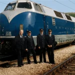 The Blue Train with its crew standing in front of it